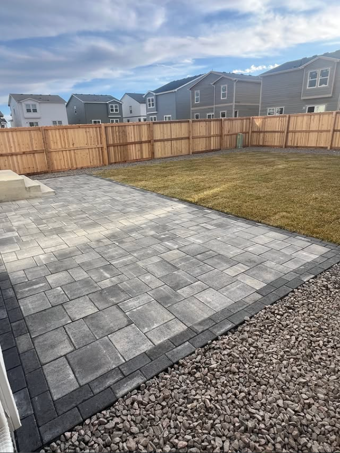Large interlock backyard patio installation in the GTA